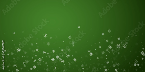 Beautiful snowfall christmas background. Subtle flying snow flakes and stars on christmas green background. Beautiful snowfall overlay template. Wide vector illustration.