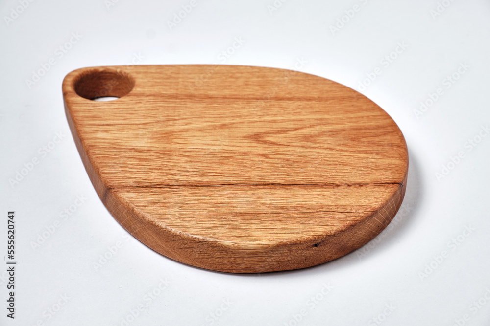 Handmade oak chopping board on white background