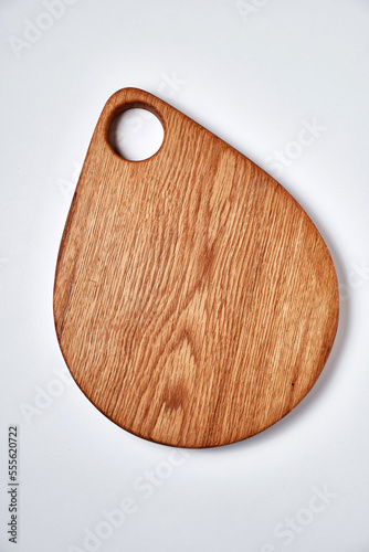 Handmade oak chopping board on white background