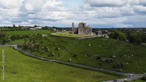 A  drone  rising location shot of The Rock of Cashel which  is the ancient seat of those who ruled the province of Munster in Ireland  in  times before the Norman invasion, photo