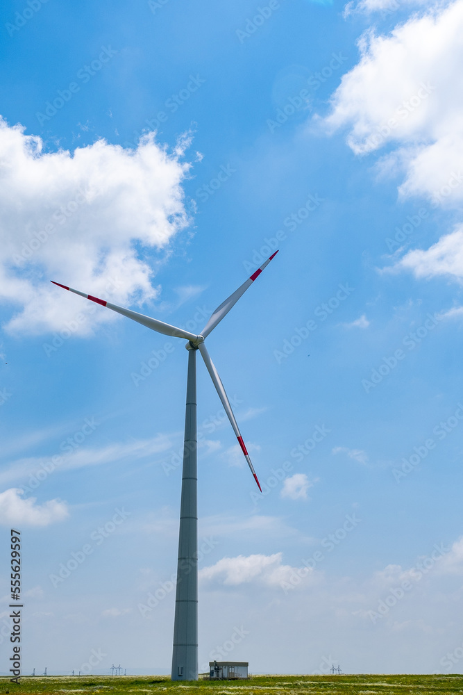 huge wind generators in nature. Green clean energy. Conservation of natural resources thanks to windmills