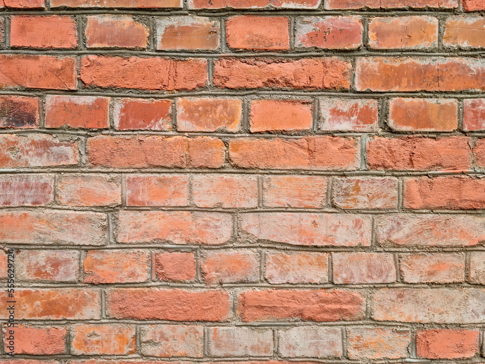 An old red brick wall. Historical horizontal brickwork for wallpaper and surface design. Brick pattern. An old red brick wall. Historical horizontal brickwork for wallpaper and surface design. Brick pattern.