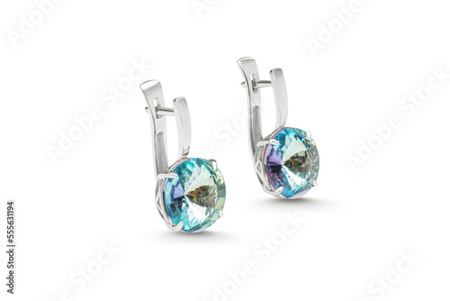 Isolated earrings with a large sparkling crystal on a white background. Luxurious jewelry for the catalog. Advertising photo for a jewelry store website