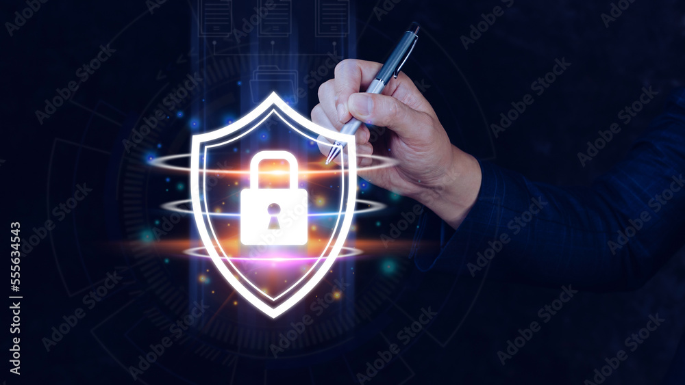 Fototapeta premium Computer network protection, secure and safe your data concept, businessman holding shield protection icon, Security shield Lock Security Businessman Protect Concept