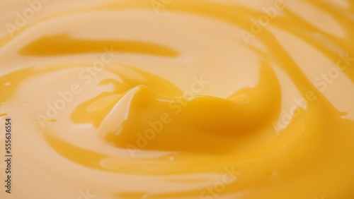 Yellow cheese sauce close up