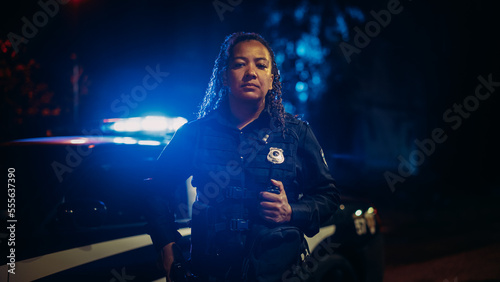 Professional Blaсk Female Police Officer Looking at the Camera. Policewoman Maintains public order and safety, Enforcing the Law, Prevents and Investigates Criminal Activity. Medium Portrait