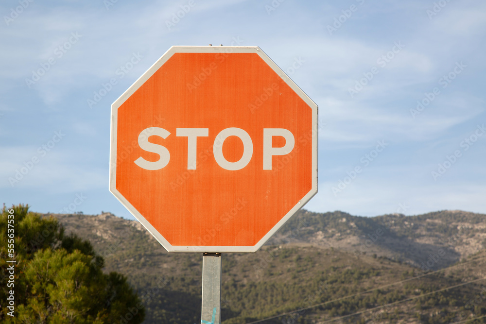 Red Stop Sign in Rural Setting