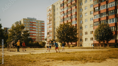 Neighborhood Kids Playing Soccer in the Hood. Young Football Player Dribbling and Scoring a Fascinating Goal. Boys and Girls High Five, Celebrate the Victory.