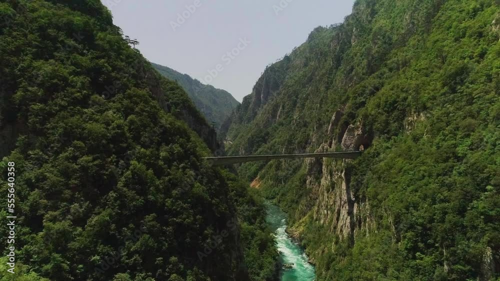 Aerial video. Shooting a beautiful gleby gorge and bridge on a sunny summer day Aerial video. Shooting a beautiful gleby gorge and bridge on a sunny summer day