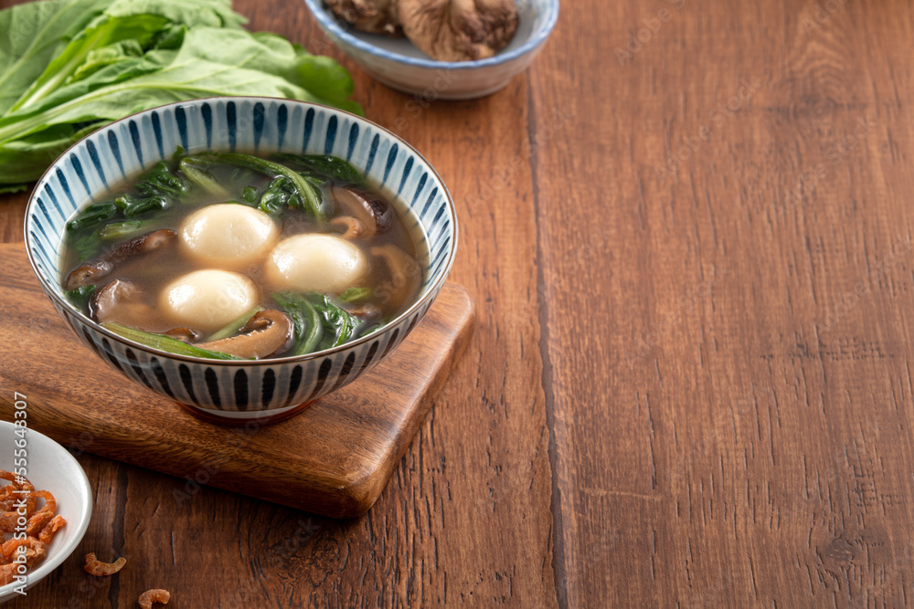 Eating big tangyuan yuanxiao with savory soup in Taiwan. Eating big tangyuan yuanxiao with savory soup in Taiwan.