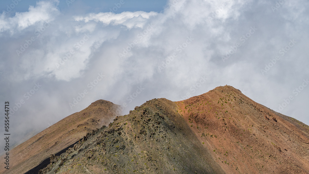 panoramic view of the mountain peaks in the clouds. mountain gorge. glaciers, permafrost panoramic view of the mountain peaks in the clouds. mountain gorge. glaciers, permafrost