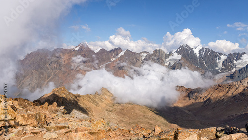 panoramic view of the mountain peaks in the clouds. mountain gorge. glaciers, permafrost