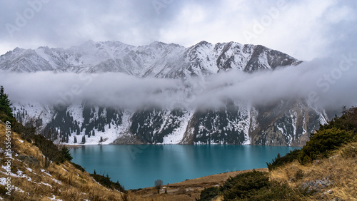 moraine lake in a mountain gorge. beautiful mountain lake. turquoise watercolor