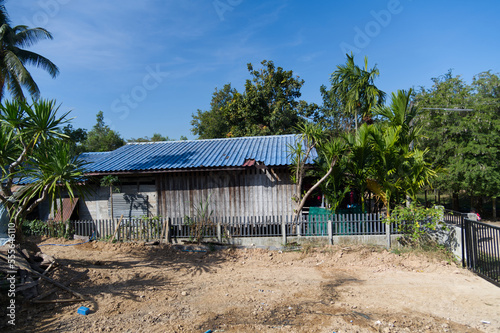 Old wooden house against blue sky