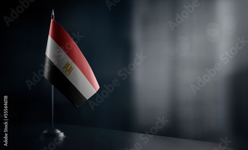 Small national flag of the Egypt on a black background photo