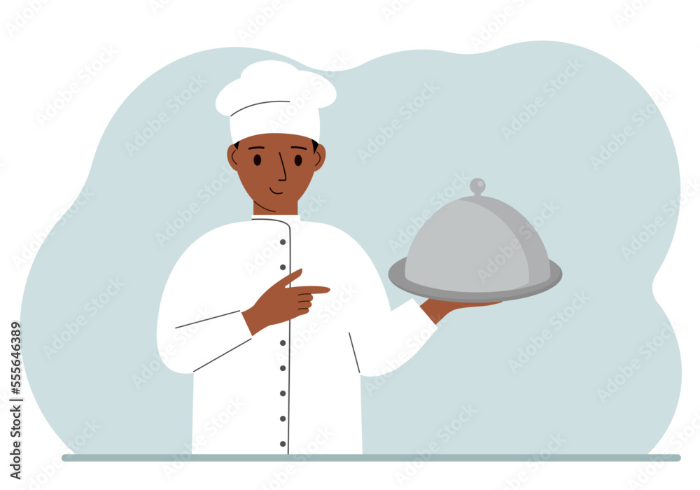 A male chef with a plate covered with a cloche or a tray with a lid.