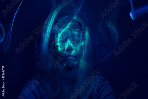 Face of a woman with online light effects. Futuristic look.