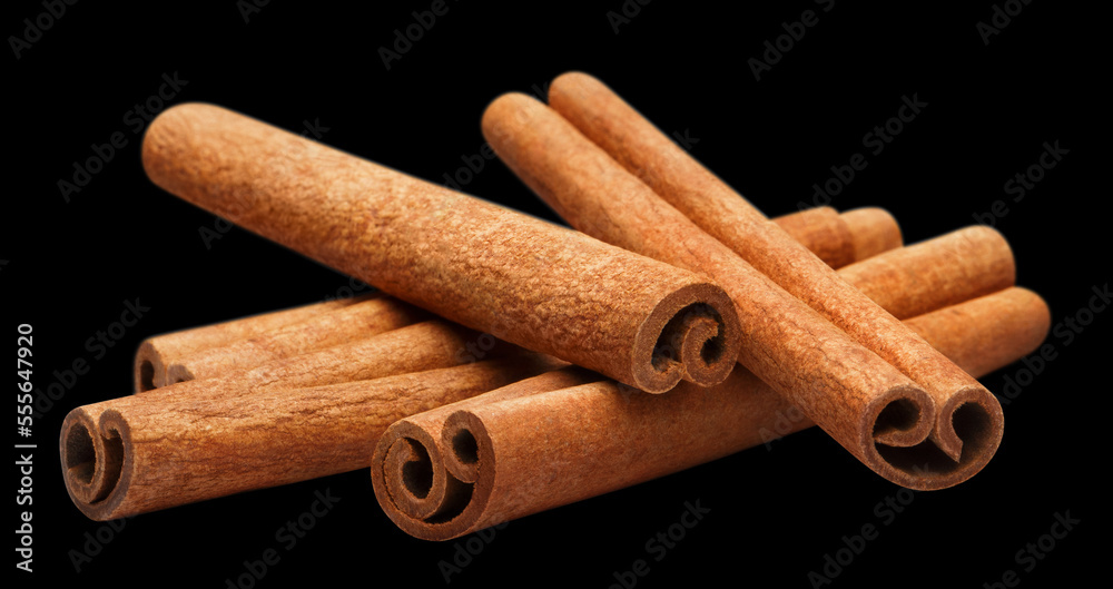 Delicious cinnamon sticks, isolated on black background Delicious cinnamon sticks, isolated on black background