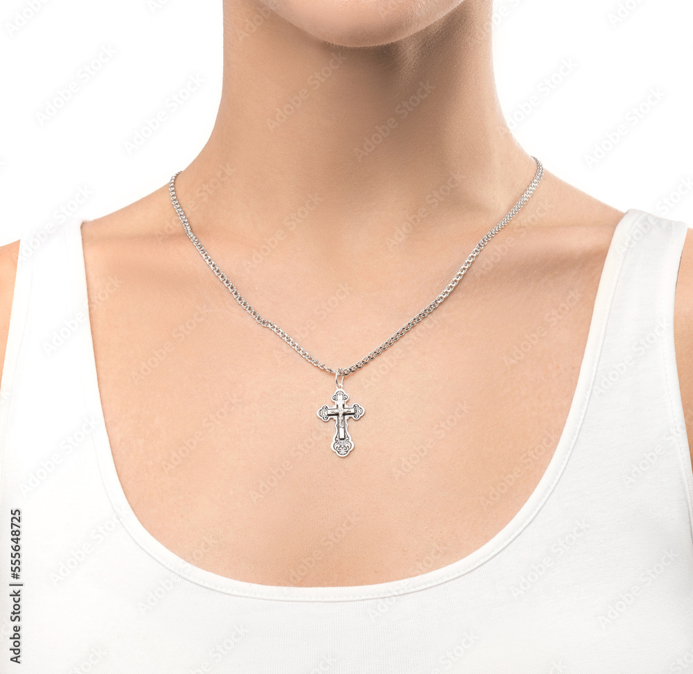 isolated on white background jewelry silver cross on a silver chain around the neck of a model girl. Front and side view of jewelry on girl isolated on white background jewelry silver cross on a silver chain around the neck of a model girl. Front and side view of jewelry on girl
