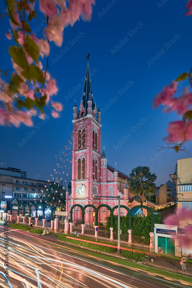 Fototapeta premium Beautiful night at Tan Dinh parish church or Church of the Sacred Heart of Jesus is a church located in Ho Chi Minh City. Selective focus, blue hour. Travel concept