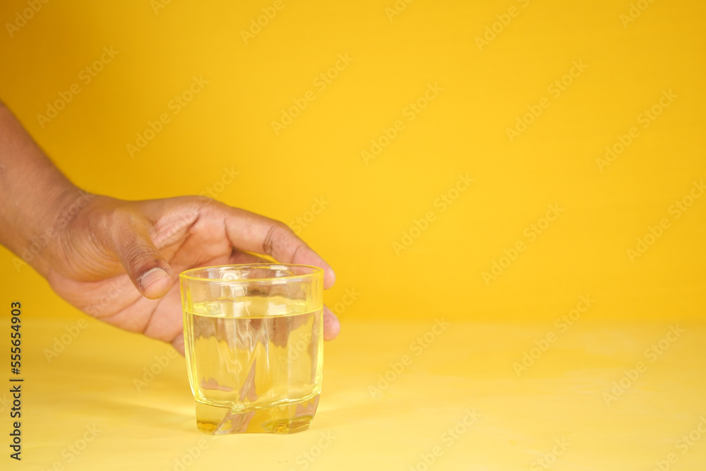 hand pick a glass of water on table hand pick a glass of water on table