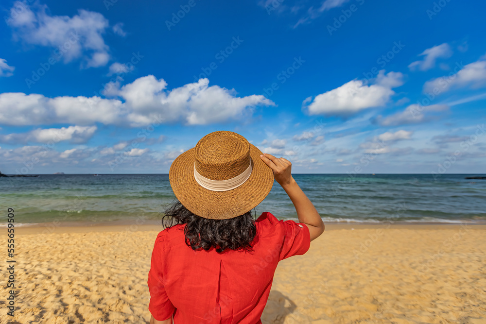 ASIA WOMAN IS RELAXING, STANDING, WARKING ON KY CO BEACH, QUY NHON, BINH DINH, VIETNAM