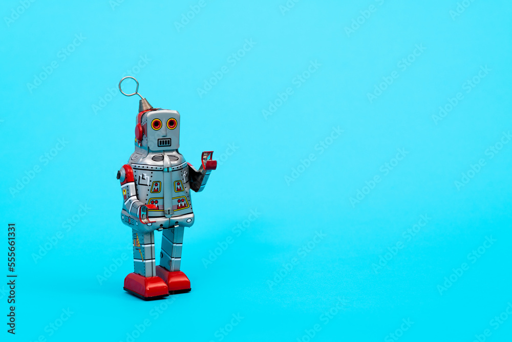Retro robot toy on blue background Retro robot toy on blue background