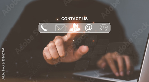 Customer support hotline Contact us people connection. Businessman using Smart Phone with the email, call phone, address, Chat message icons.
