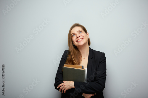 Woman teacher looking up. Isolated portrait with copy space.