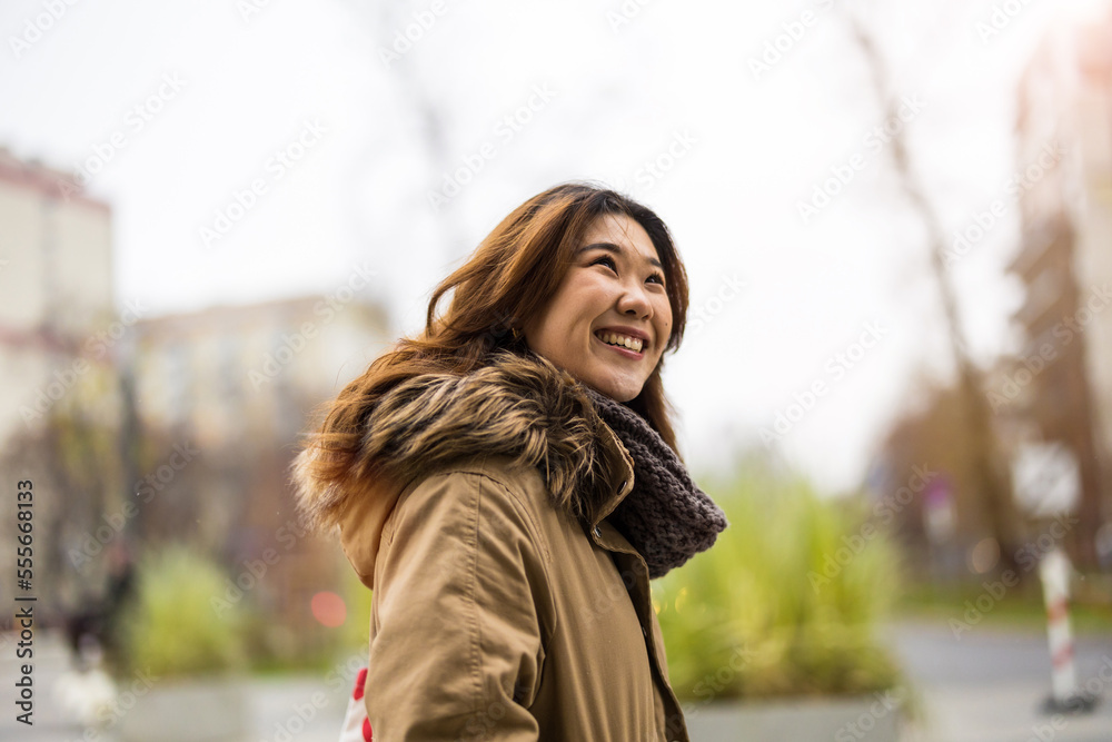 Portrait of young woman in the city
