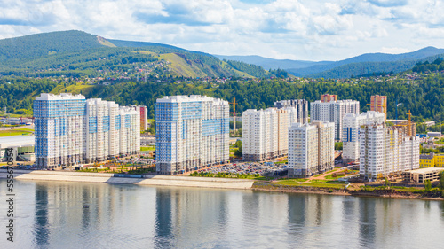 Residential area with multi-apartment high-rise buildings on embankment of Yenisey river  Krasnoyarsk