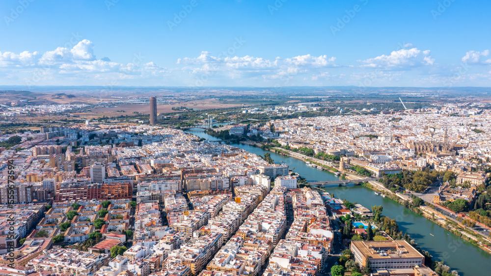 Obraz premium Aerial view of the Spanish city of Seville in the Andalusia region on the river Guadaquivir overlooking the cathedral