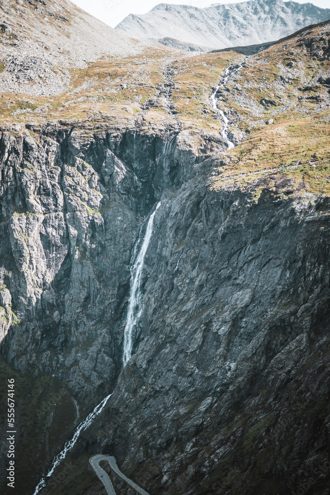 Waterfall at the trollstigen road in Norway with some mountains. Waterfall at the trollstigen road in Norway with some mountains.