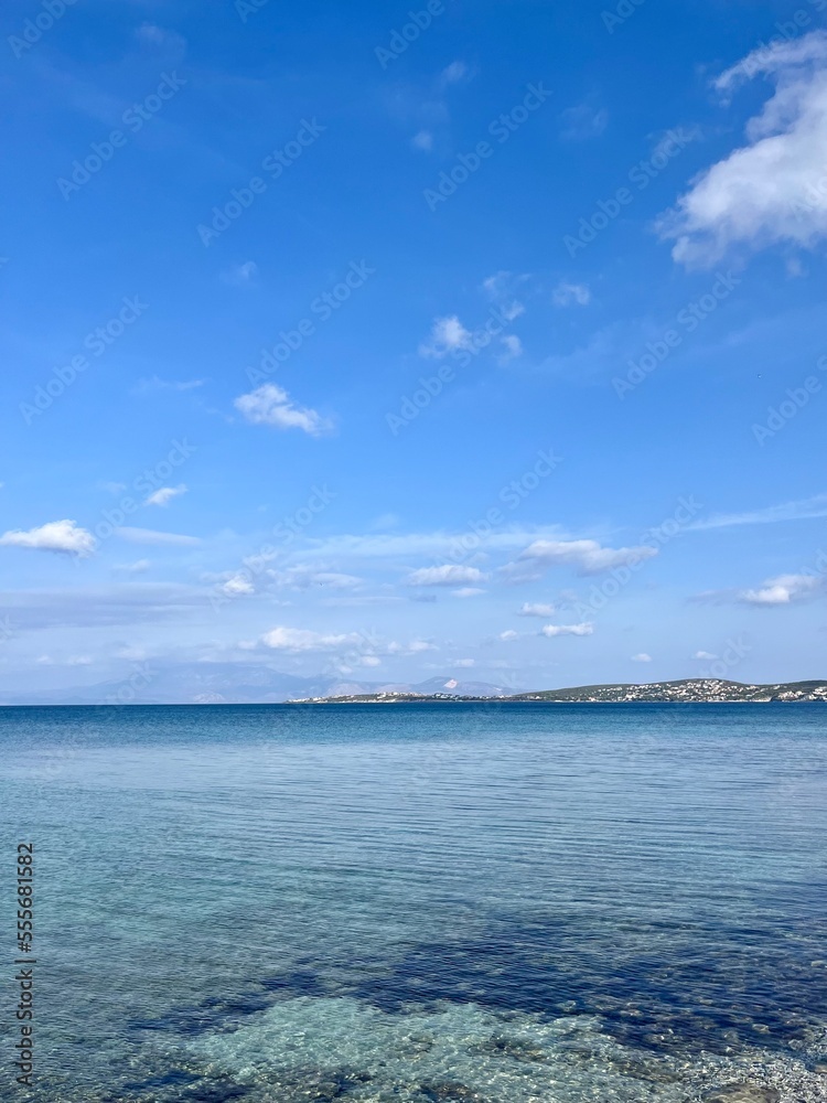 Transparent sea surface, blue sea horizon, blue seascape background