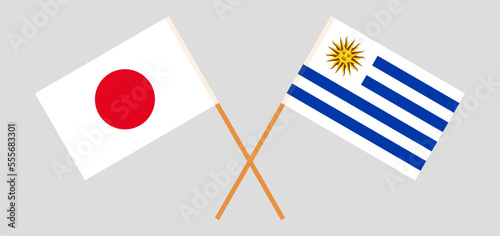 Crossed flags of Japan and Uruguay. Official colors. Correct proportion