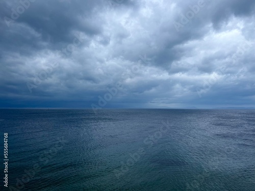 Cloudy sea view, dark clouds at the sea, rocky coast фототапет