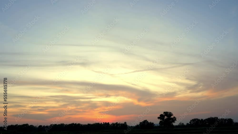 clouds evening sky twilight rice fields Thailand,Golden clouds from the sunlight,time lapse video backlit sun clouds evening sky twilight rice fields Thailand,Golden clouds from the sunlight,time lapse video backlit sun