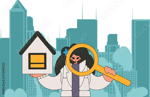 The concept of owning a home. An attractive realtor girl holds a house in her hands.