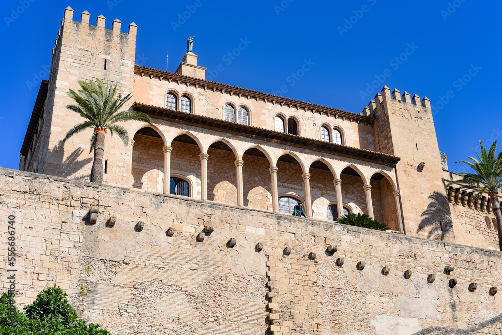 Palma de Mallorca, Spain - 7 Nov, 2022: Towers and outer walls of the Royal Palace of La Almudaina