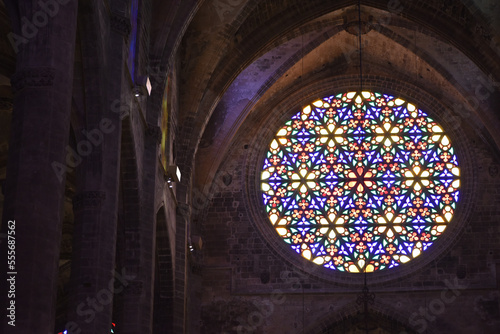 Palma, Mallorca, Spain - 10 Nov 2022: Colourful stained glass Rose Window in Palma Cathedral photo