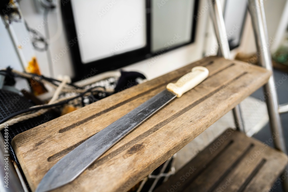 big fish gutting knife on a fishing boat big fish gutting knife on a fishing boat