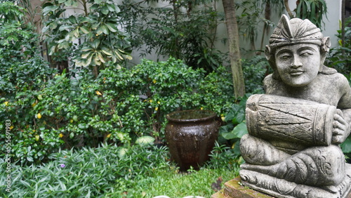 Calm quite Public park with statue on huge old tree. Greenery environment suitable for relaxation and meditation