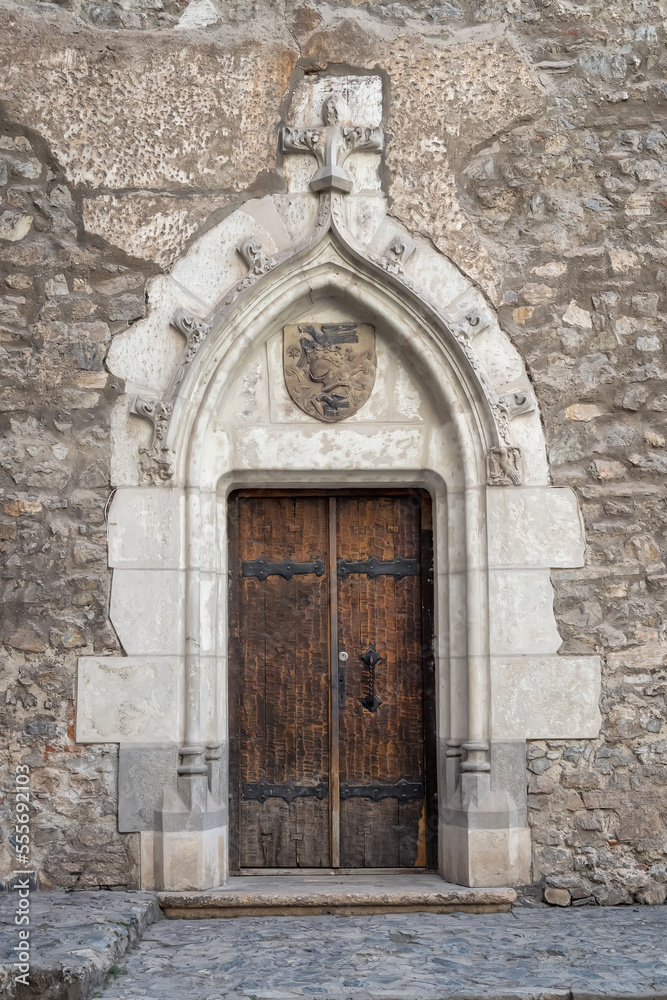 Old decorated vintage door with wood carving and beautiful design, in Romania