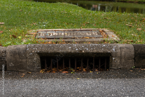 Old fashioned curbside storm drain photo