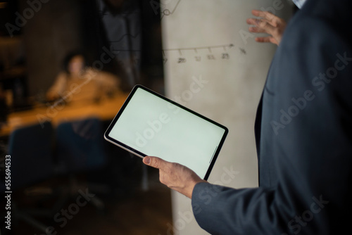 Close up of man using digital tablet.