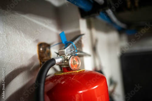 fire extinguisher in the engine room of a boat
