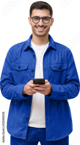 Smiling young man in blue shirt and glasses, holding smartphone © Damir Khabirov