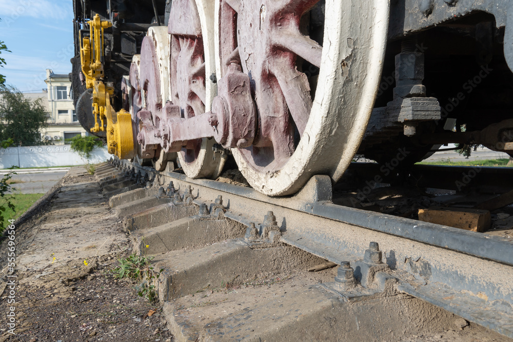 Close-up drive wheels and rods on steam engine locomotive. Vintage part ...