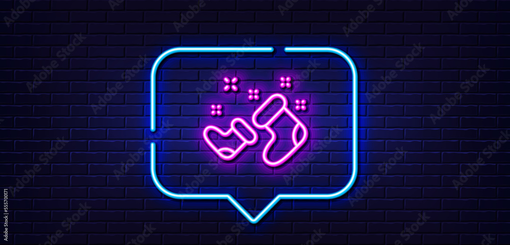 Neon light speech bubble. Santa boots line icon. Christmas or New year sign. Claus symbol. Neon light background. Santa boots glow line. Brick wall banner. Vector Neon light speech bubble. Santa boots line icon. Christmas or New year sign. Claus symbol. Neon light background. Santa boots glow line. Brick wall banner. Vector