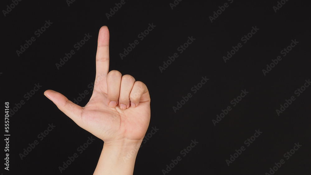 Looser hand sign on black background. Looser hand sign on black background.